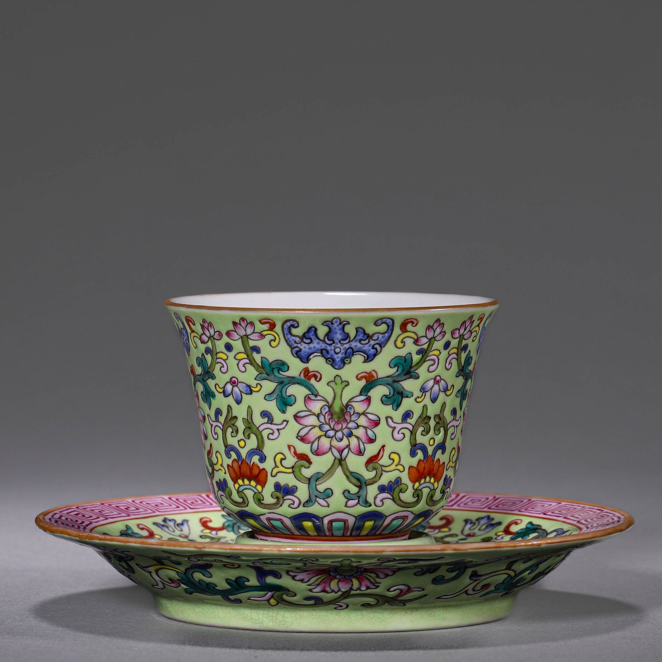 3337:A Pair of Floral Cups and Saucers with Bathing Pavilion Green Ground Famille Rose