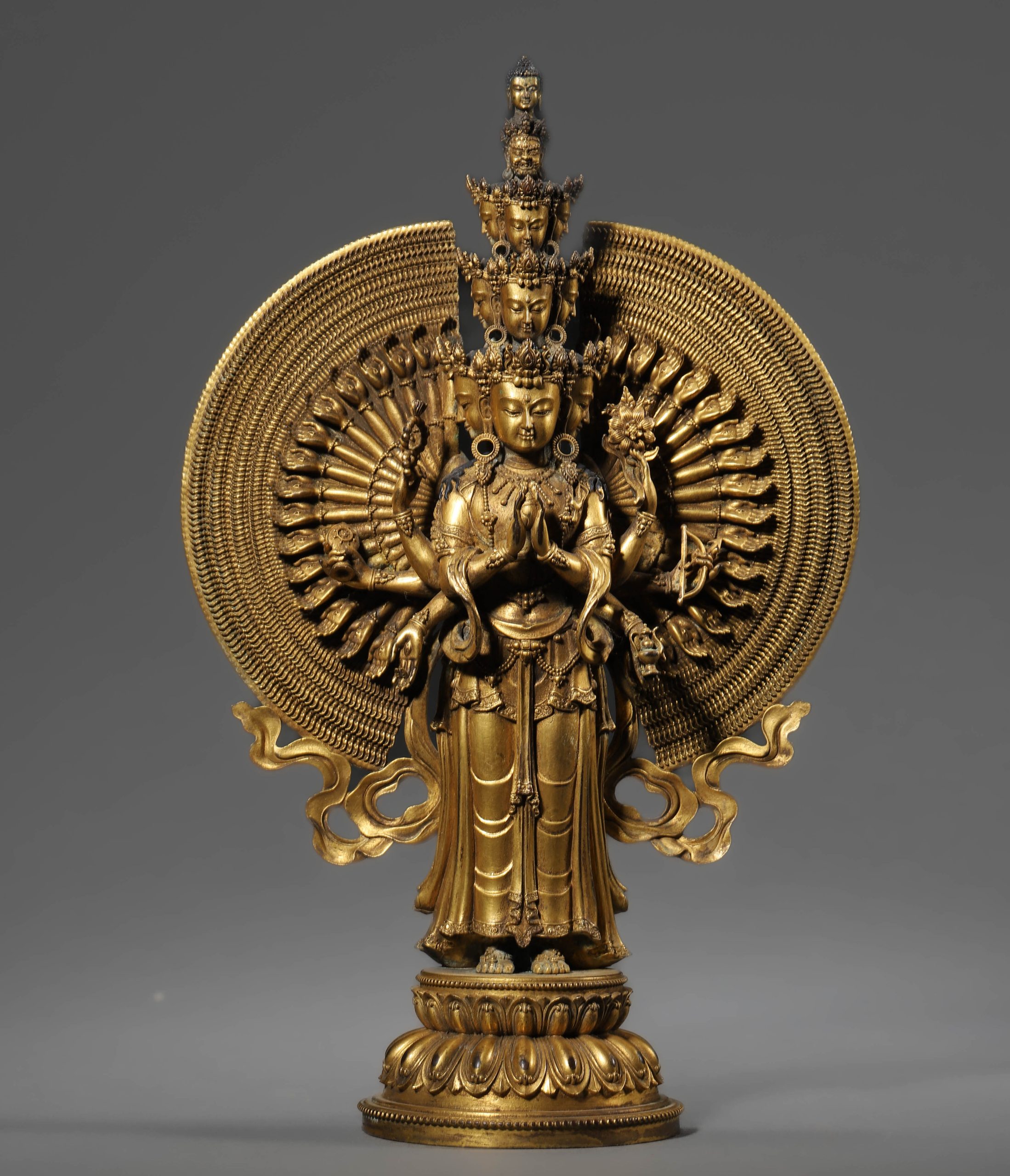 A CHINESE GILT BRONZE BUDDHA WITH A THOUSAND HANDS, POSSIBLY QING DYNASTY, 18TH–19TH CENTURY.
