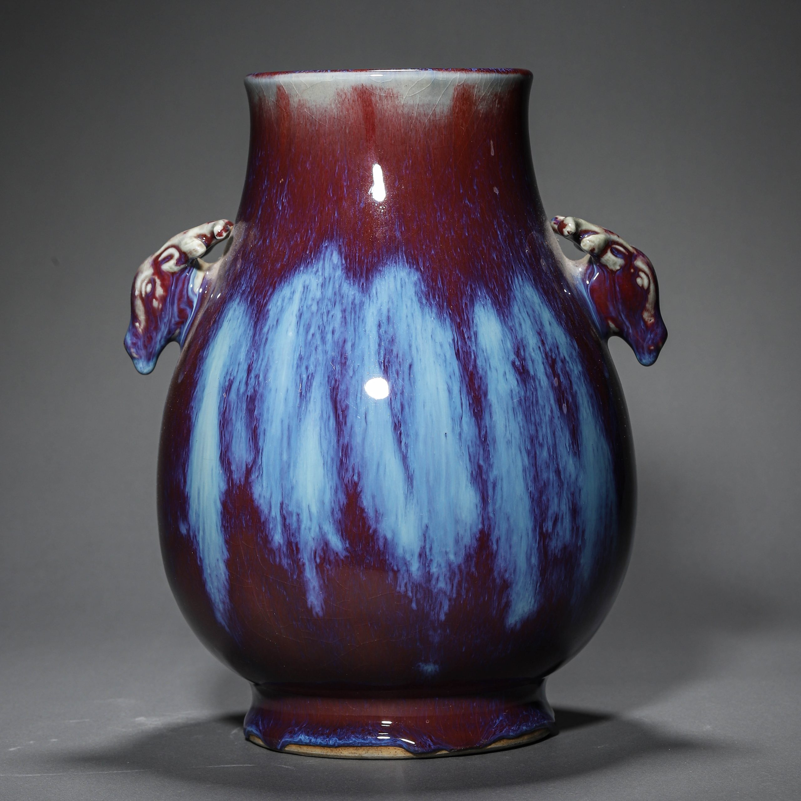 A CHINESE FLAMBE GLAZE VASE WITH DEER HEAD DESIGN, POSSIBLY QING DYNASTY, 18TH CENTURY.