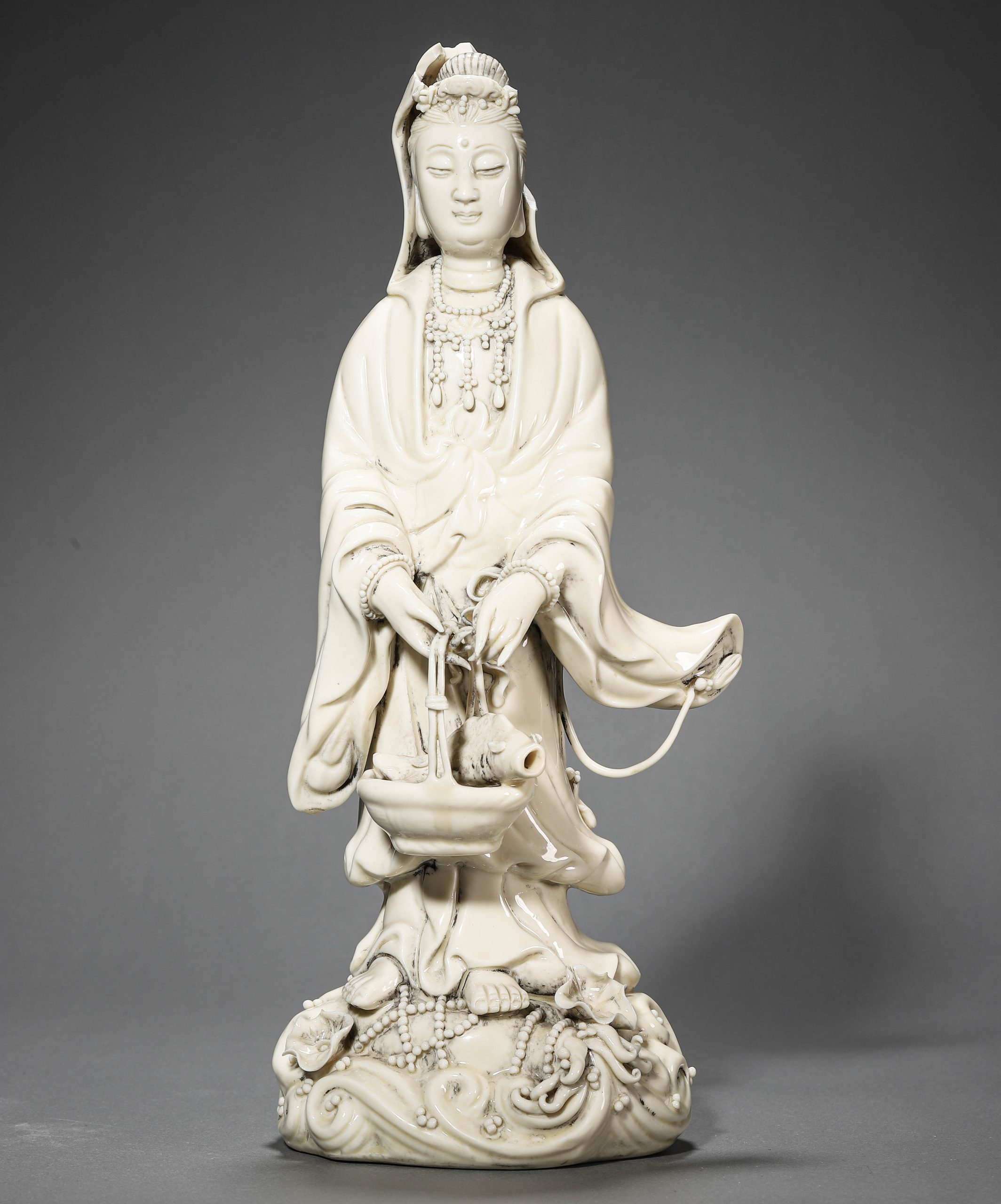 A CHINESE FIGURE OF DEHUA GUANYIN, BY HE CHAOZONG, POSSIBLY MING DYNASTY, 17TH CENTURY.