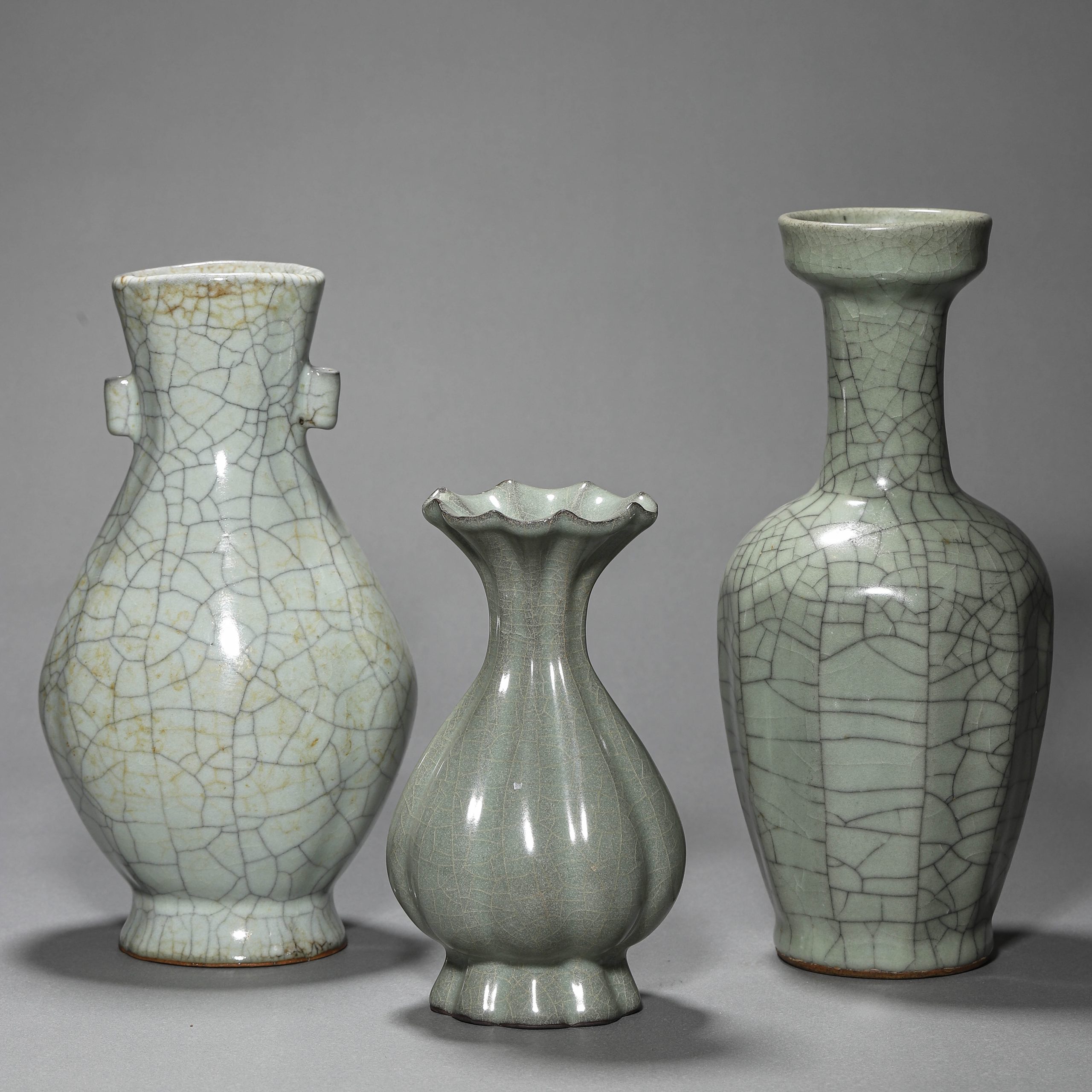 A GROUP OF THREE CHINESE SONG DYNASTY CELADON BOTTLES, POSSIBLY 10TH–13TH CENTURY.