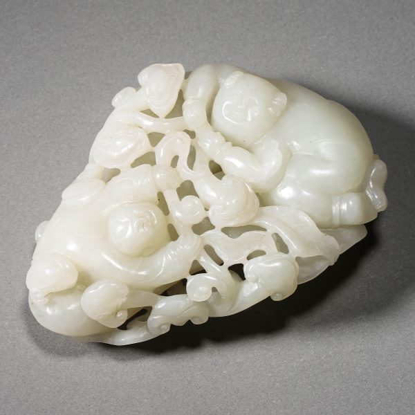 A CHINESE WHITE JADE FIGURE OF A CHILD