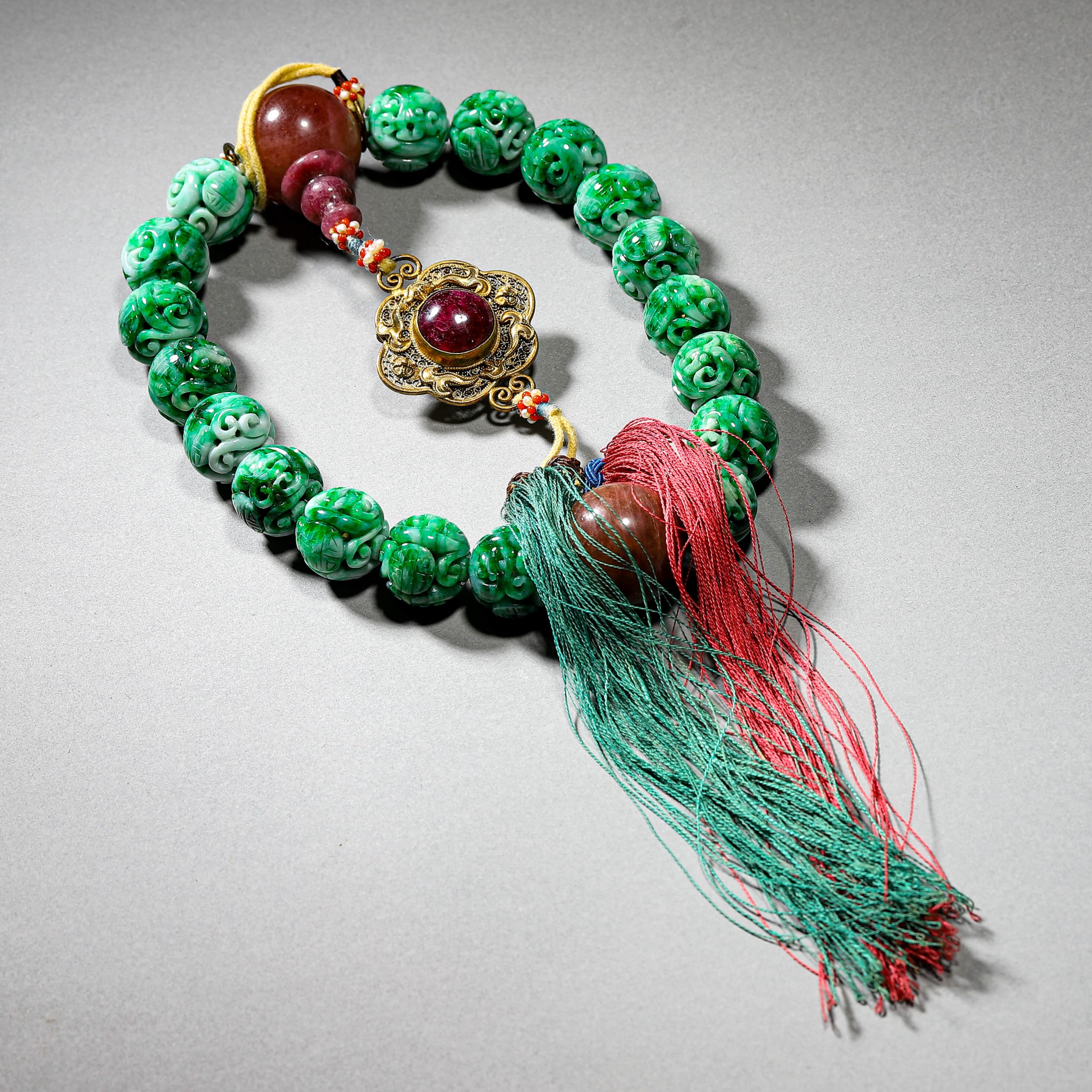 A CHINESE JADE HAND-HELD SCHOLAR’S STONE, POSSIBLY QING DYNASTY, 18TH–19TH CENTURY.